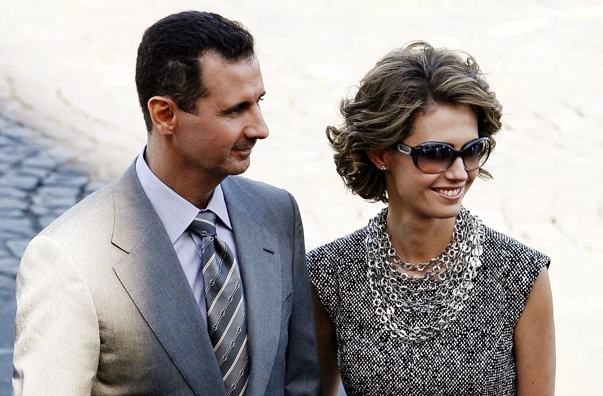 Асма Асад с мужем Башаром Асадом на параде в честь Дня взятия Бастилии в Париже